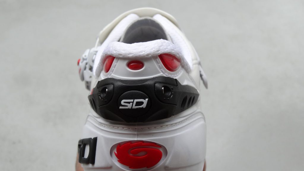 Adjustable heel retention device